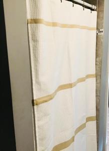 a shower curtain in a bathroom with a shower curtain at Loft Guest Suite 1 Bedroom in Charleston