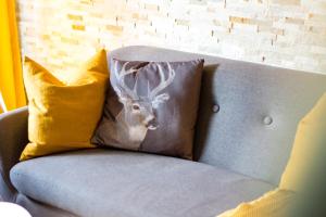 a picture of a deer pillow on a chair at Urlaub in Andreasberg in Sankt Andreasberg