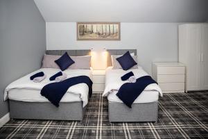 Säng eller sängar i ett rum på St Andrews Guest House