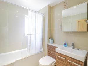 a bathroom with a sink and a toilet and a shower at Kinsale in Broadstairs +28 photos
