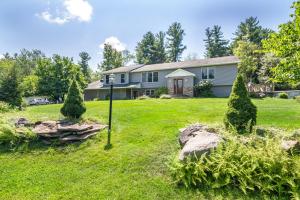 a house with a yard with a rock garden at Southwoods Mountain Estate -private mansion, pool, hottub+ 15 acres in Monticello