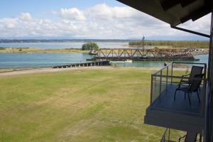 a balcony of a house with a view of a dock at Swinomish Casino & Lodge in Anacortes
