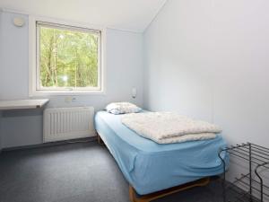 Tempat tidur dalam kamar di Holiday home Herning III