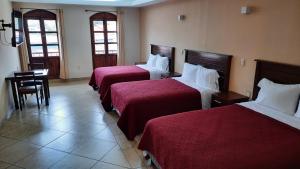 Postel nebo postele na pokoji v ubytování Suites Del Risco