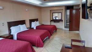 Postel nebo postele na pokoji v ubytování Suites Del Risco