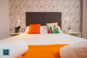 Posteľ alebo postele v izbe v ubytovaní Maria Rosa Urban & Beach Apartment