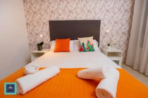 Posteľ alebo postele v izbe v ubytovaní Maria Rosa Urban & Beach Apartment