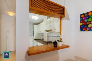 Kuchyňa alebo kuchynka v ubytovaní Maria Rosa Urban & Beach Apartment