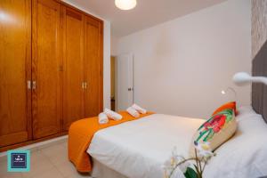 Posteľ alebo postele v izbe v ubytovaní Maria Rosa Urban & Beach Apartment