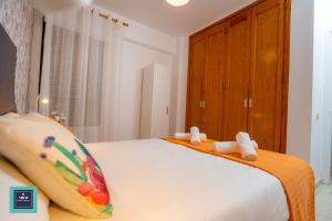 Posteľ alebo postele v izbe v ubytovaní Maria Rosa Urban & Beach Apartment