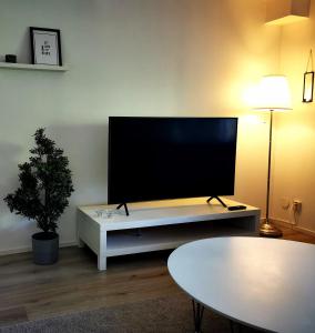 
A television and/or entertainment center at Landvetter Apartment
