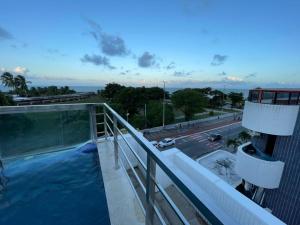 a swimming pool on the roof of a building at Israel Flat Tambaú in João Pessoa