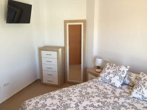 Łóżko lub łóżka w pokoju w obiekcie Costa del Algarve