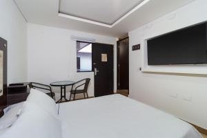 Cama o camas de una habitación en Hotel 0asis de la Colina Boutique