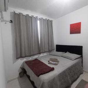 Een bed of bedden in een kamer bij Apto Campos temporada