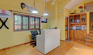 an office with a white desk and chairs in a room at Itsy By Treebo - Vailankanni Natures Inn in Panaji