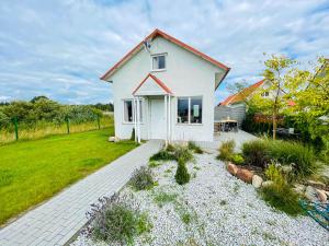 Vonkajšia záhrada v ubytovaní Magic Home Łeba