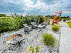 Vonkajšia záhrada v ubytovaní Magic Home Łeba