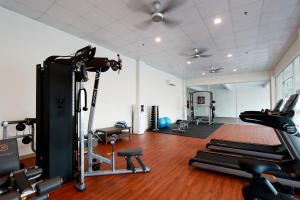 a gym with cardio equipment in a room at Villea Rompin Resort & Golf in Kuala Rompin