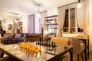 a living room with a chess board on a table at Villa Sokol in Borovets