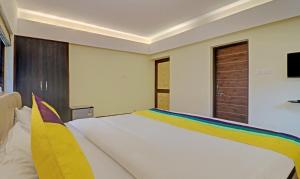 Postel nebo postele na pokoji v ubytování Itsy Hotels Vailankanni Natures Inn