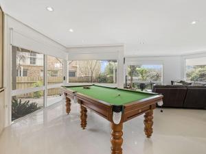 a large living room with a pool table at Blue Horizon Mt Eliza in Mount Eliza