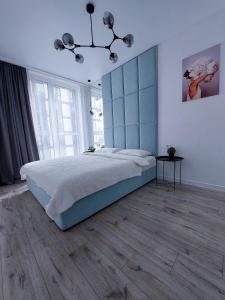 Llit o llits en una habitació de AVALON on Lypynskogo street (New building)