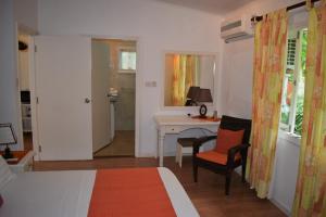 Ένα ή περισσότερα κρεβάτια σε δωμάτιο στο Sunbird Bungalow