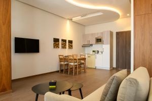 a living room with a couch and a table at BH Appart Hotel in Casablanca