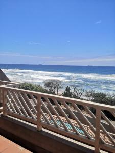 a view of the ocean from a balcony at Ann's Place in Umdloti
