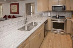 a kitchen with a sink and a stove at Gateway Plaza R4 Condo in Vail