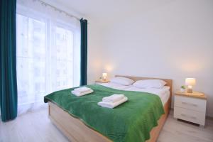 Apartamenty Bryza-Monte Cassino 8 객실 침대