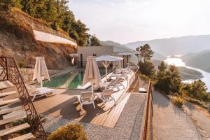 a villa with a pool and a view of the ocean at Encosta de Louredo by Pousadela Village in Vieira do Minho