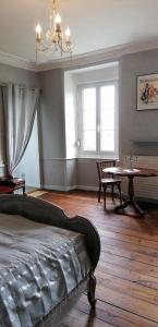 Postel nebo postele na pokoji v ubytování Le Derrien + 37 fotografií