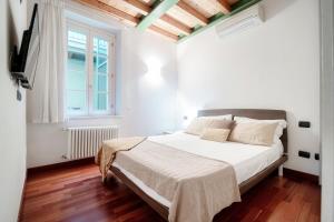 Ein Bett oder Betten in einem Zimmer der Unterkunft Appartamento Centro Storico
