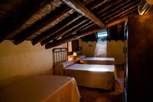 Posteľ alebo postele v izbe v ubytovaní Un espacio único, 'La Casona del Señor' con bodega