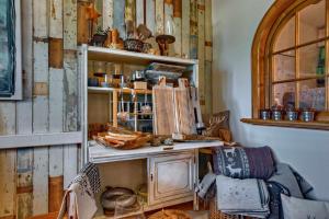 a room with a wooden cabinet with dishes on it at Allgäuer Panoramahotel in Oberstaufen