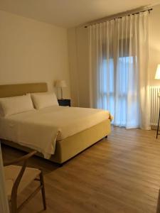 A bed or beds in a room at Magnifica Vittorio Veneto Még 8 kép