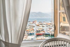 a view of a harbor with boats in the water at Angolo di mare by PortofinoVip in Portofino