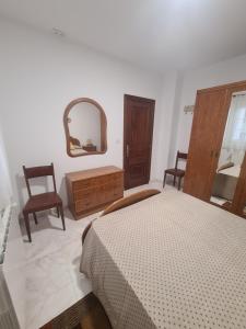 Łóżko lub łóżka w pokoju w obiekcie A Casa de Carmen