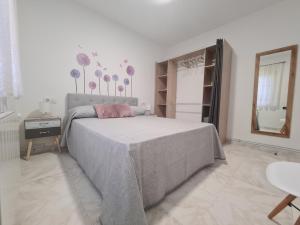 Łóżko lub łóżka w pokoju w obiekcie A Casa de Carmen