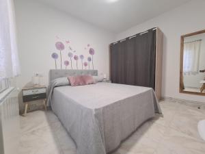 Łóżko lub łóżka w pokoju w obiekcie A Casa de Carmen