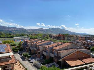 an aerial view of a city with buildings and mountains at Park Hotel Imperatore Adriano in Tivoli