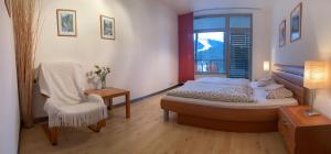 Posteľ alebo postele v izbe v ubytovaní Apartmány Čertovka