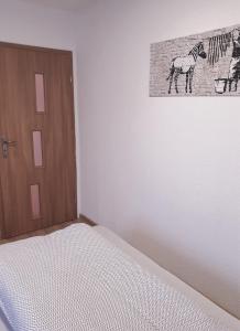 Postel nebo postele na pokoji v ubytování Vogelnest Riesa