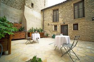 A patio or other outdoor area at El Forn de Freixenet con servicios de un hotel