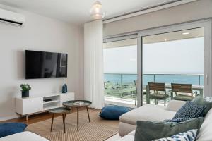 a living room with a view of the ocean at Alameda Formosa I by An Island Apart in Funchal