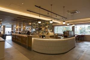 a bar in a restaurant with a counter top at Holiday Inn Edinburgh Zoo, an IHG Hotel in Edinburgh