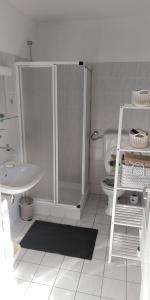 a bathroom with a shower and a toilet and a sink at Apartmán Perspekta 196 in Čatež ob Savi +25 photos