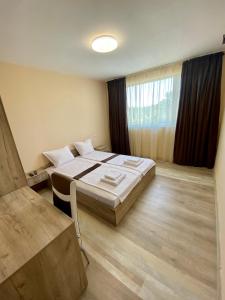 Postel nebo postele na pokoji v ubytování Hotel Sunrise